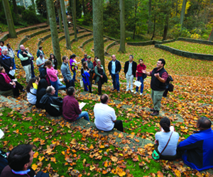 José-Luis Machado, an associate professor of biology who conducts research with students in the Crum Woods, leads parents, students, and alumni on a woods tour during Garnet Homecoming and Family Weekend in October.