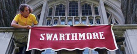 Student worker Randall Johnston ’09 affixes the Swarthmore sign to Clothier Hall in preparation for Alumni Weekend 2008. (Photo by Eleftherios Kostans)